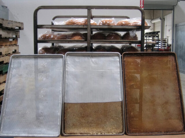 Three baking sheets. The sheet on the left is completely clean, the middle one is half clean and half dirty, and the right is completely dirty.